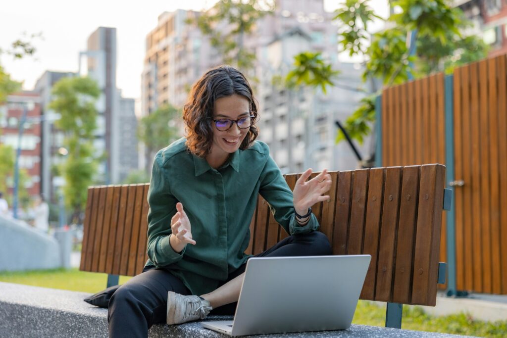 girl on bench doing a remote interview